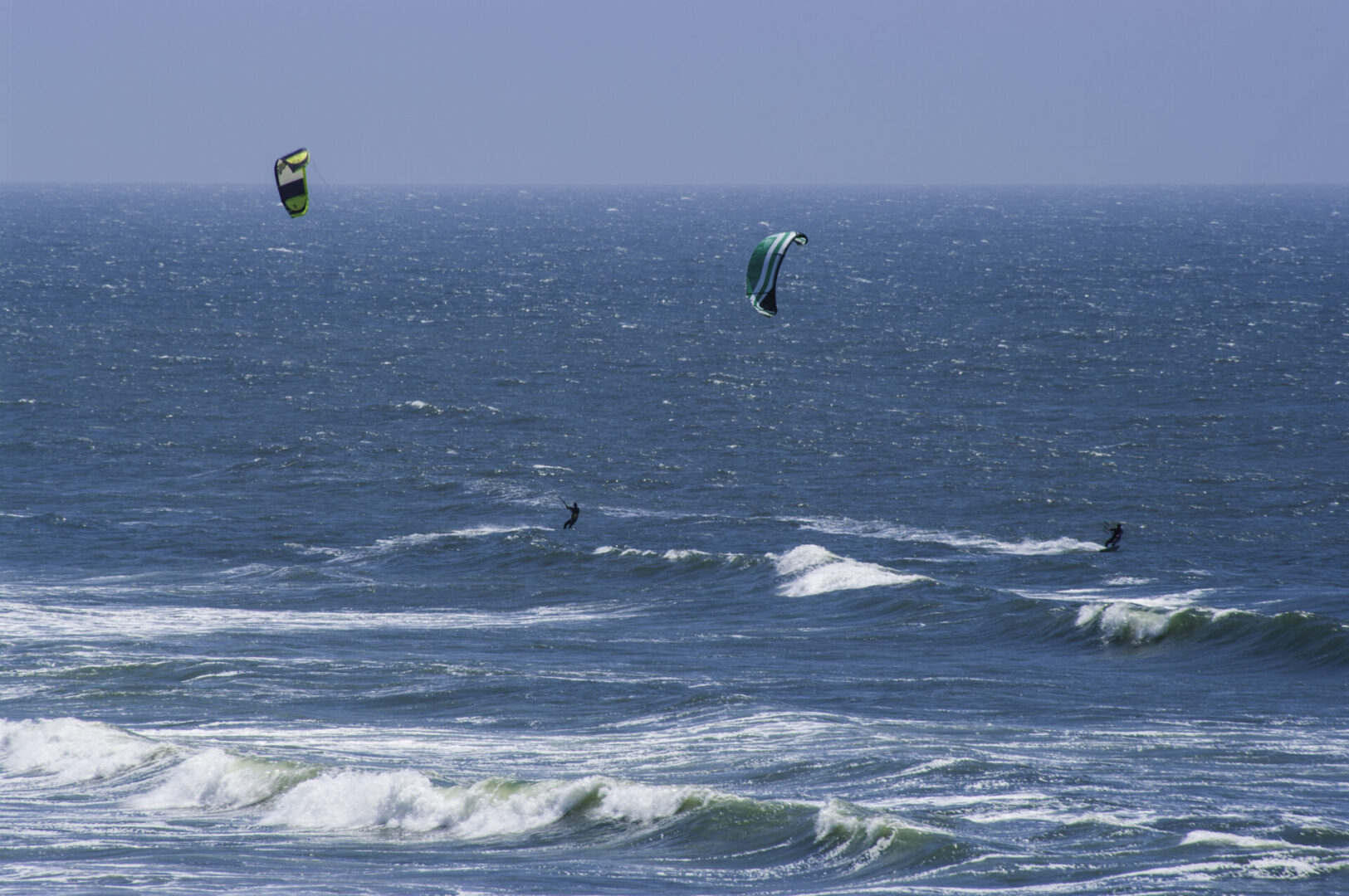 Two people parasailing