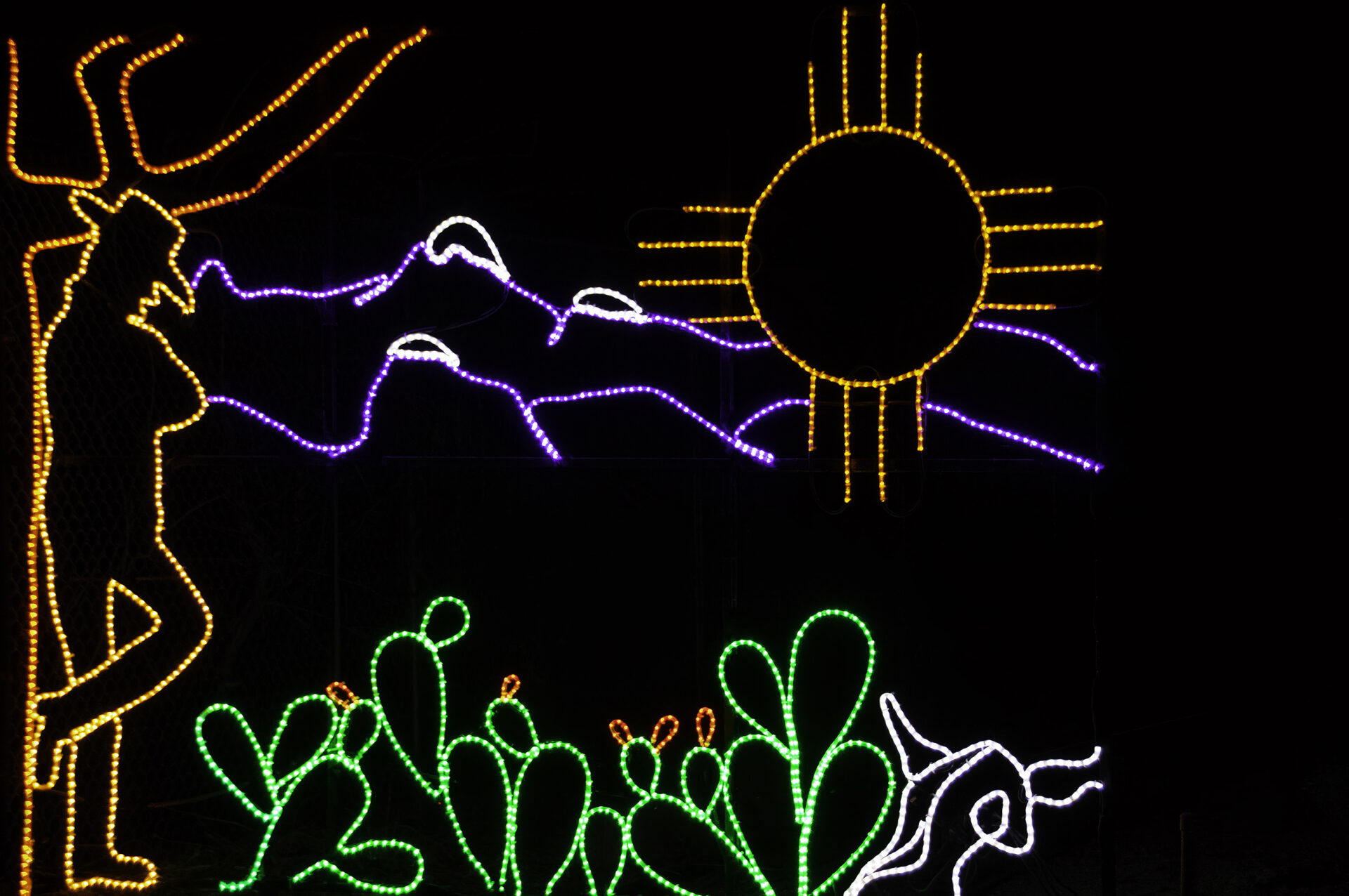 Lights forming a cowboy and a desert scenery