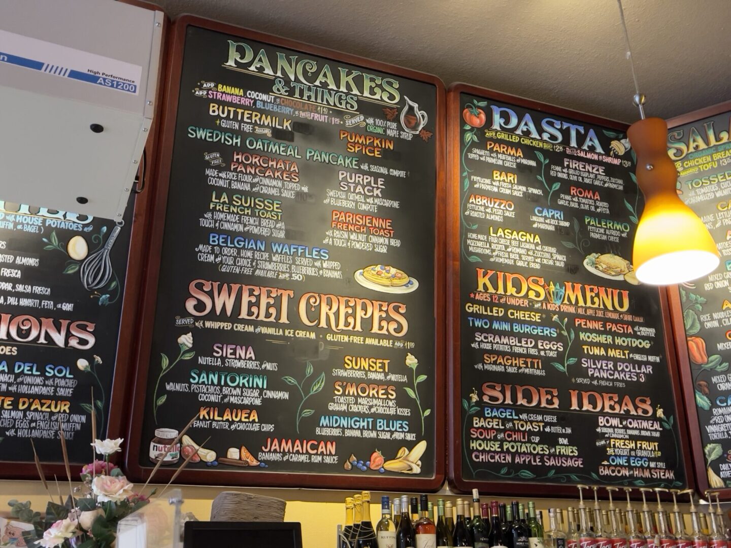 A chalkboard menu is displayed in a restaurant.